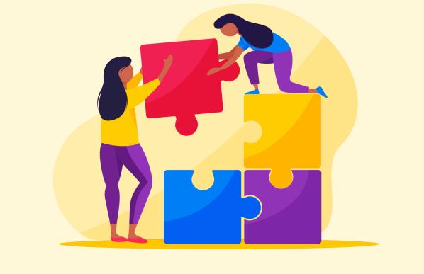 2 femmes qui construisent un puzzle